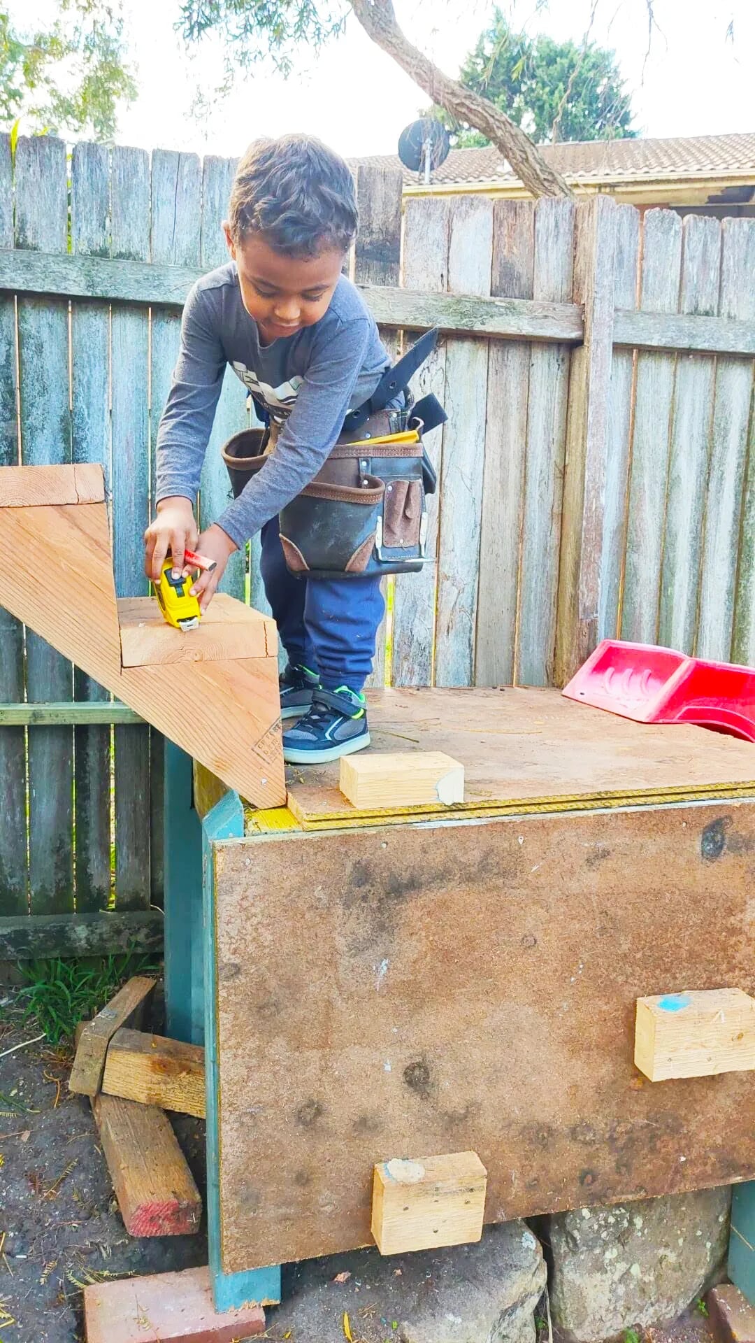 Eddie Keeng working with his young son